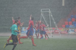 Celebrating Javi Betancort's leveler amidst a downpour.