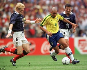 Premier League winner Colin Hendry shown here tackling Brazilian legend Ronaldo will be one of the stars on show.